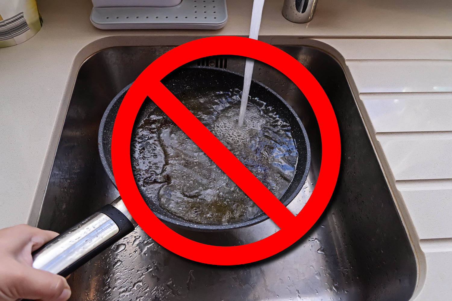 a pan being held over the sink being rinsed out and the grease going right down the sinks drain and a red cross out symbol over the pan indicating not to do it