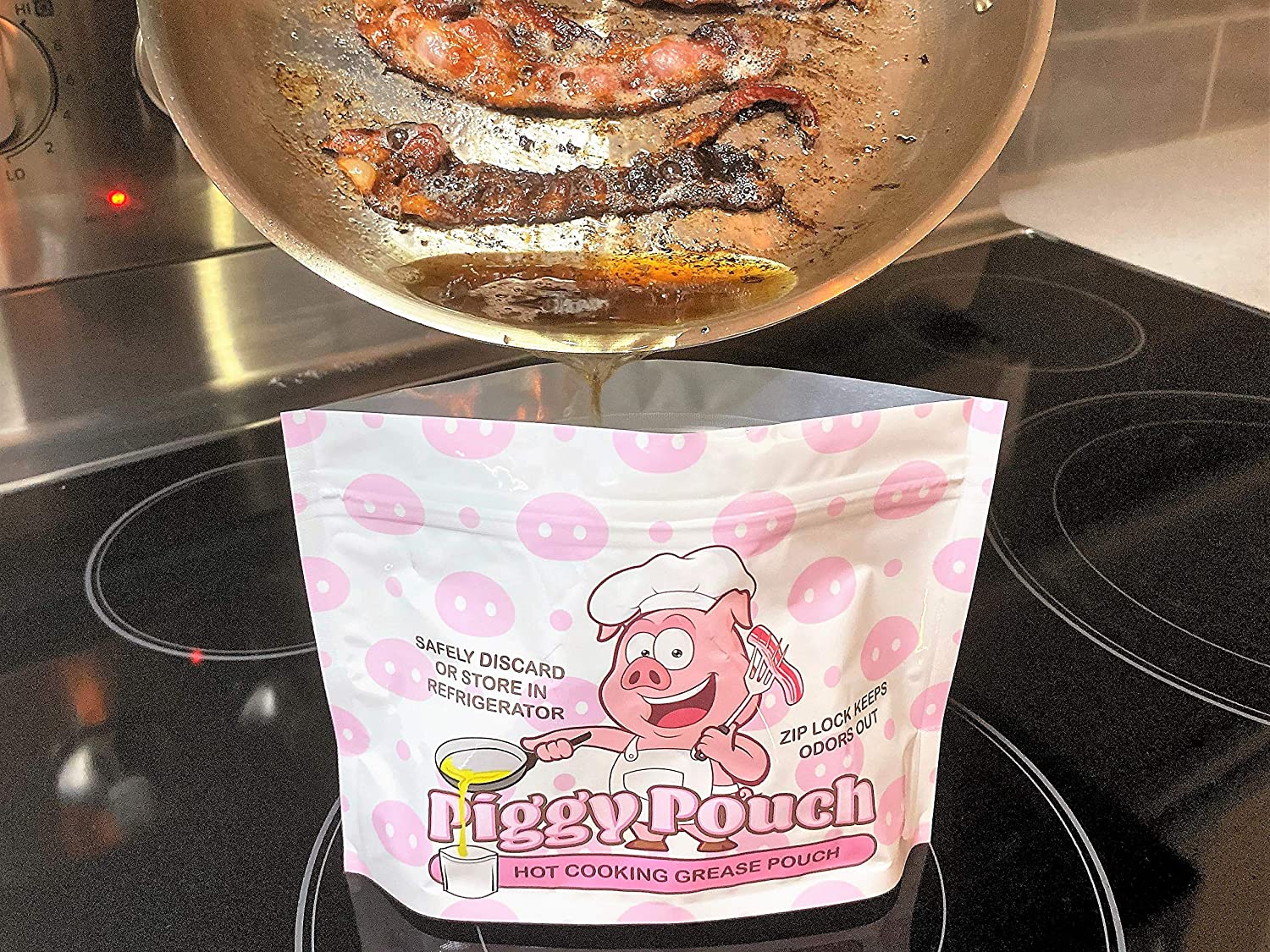 shows a the front of a piggy pouch bacon grease container opened on a stove with a pan of cooked bacon held by a hand above and the grease from the bacon being easily poured into the 12oz pouch